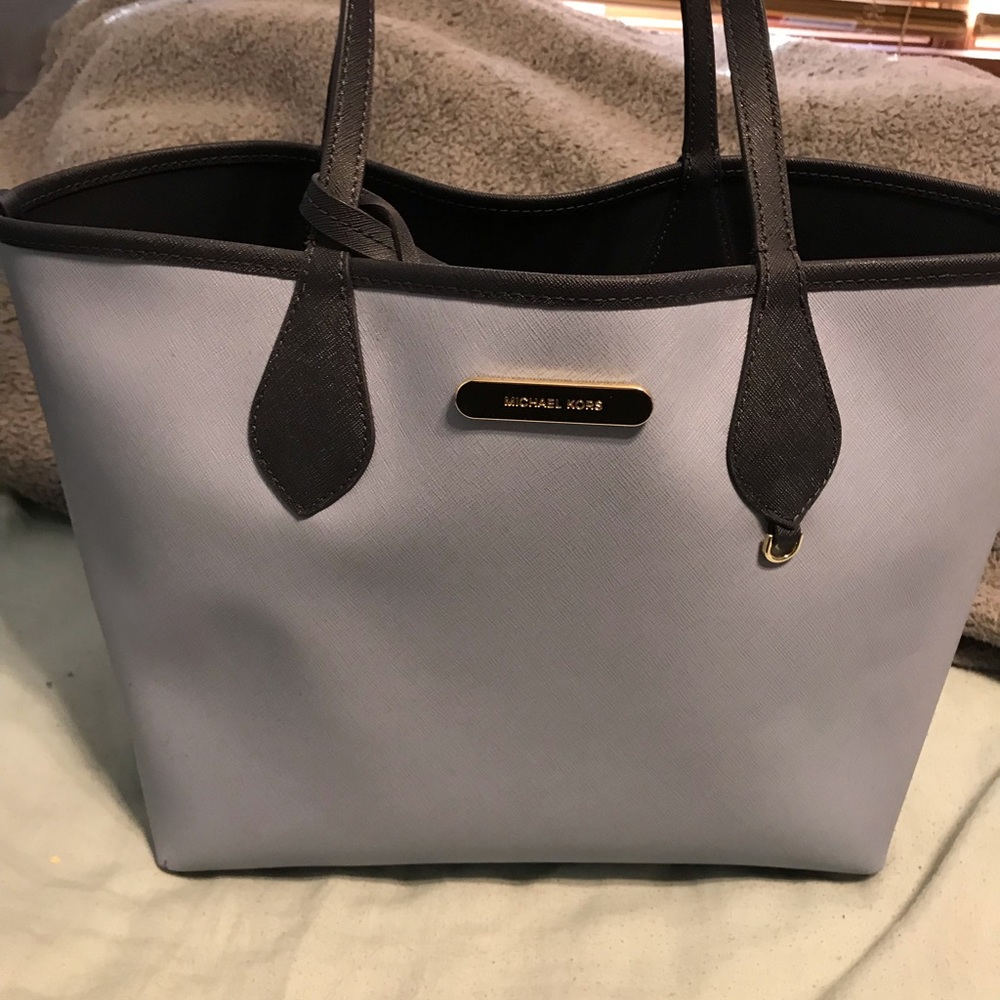 Micheal Kors reversible purse with clutch.